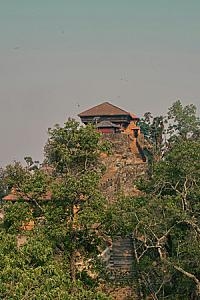 Historic Gorkha Durbar in Nepal surrounded by greenery on a hill