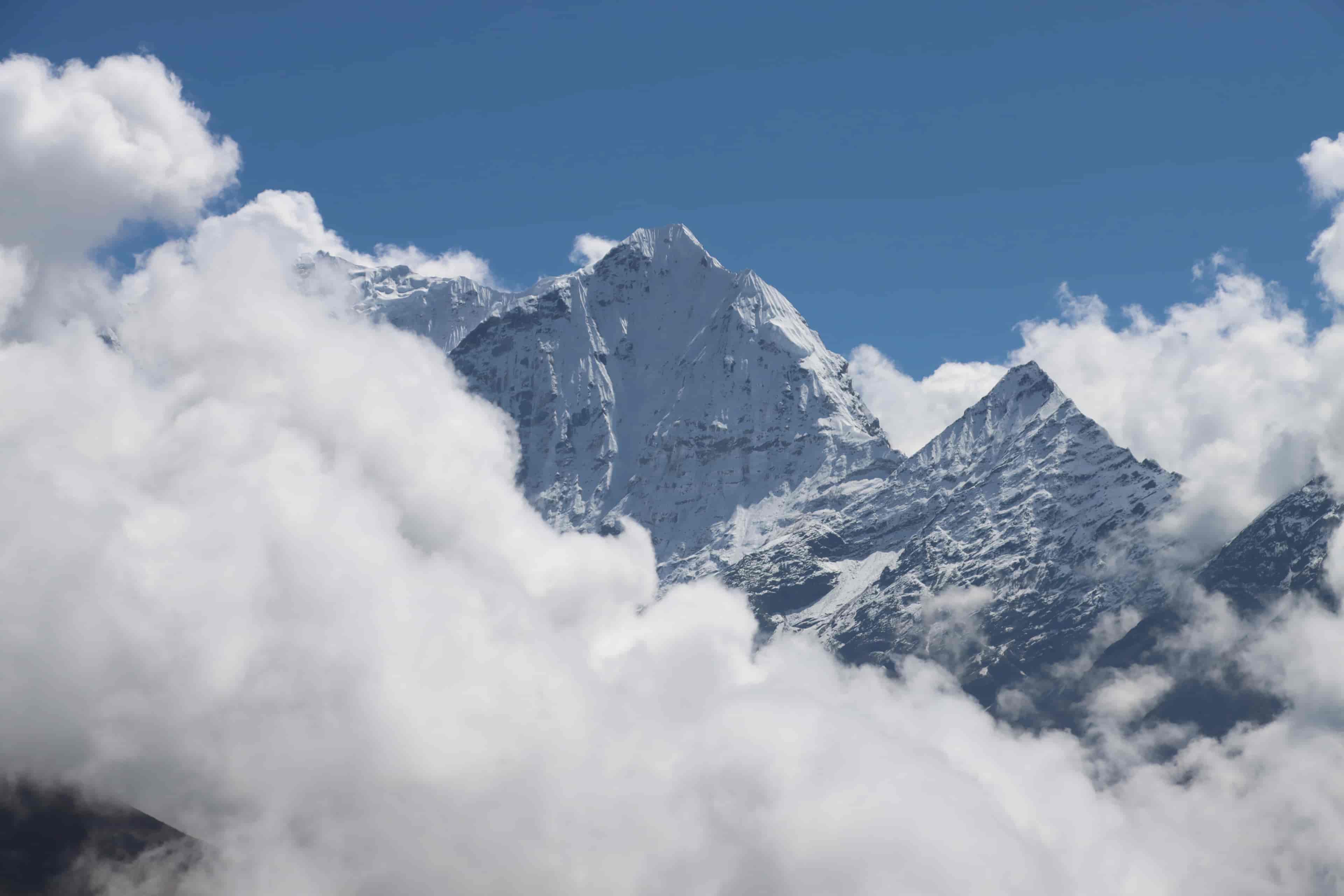 Kusum Kanguru peak shrouded in clouds as seen from above Namche Bazaar in the Everest region