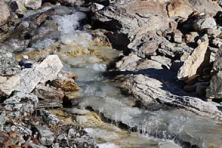 Frozen stream glistening along the trail to Cho La Pass in the Everest region