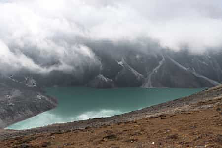Chola Tso Lake surrounded by rocky cliffs on the way to Cho La Pass, Everest Region Trekking