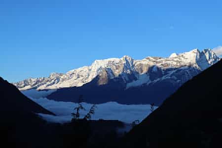 Pangboche morning landscape with snow-capped peaks in clear sky