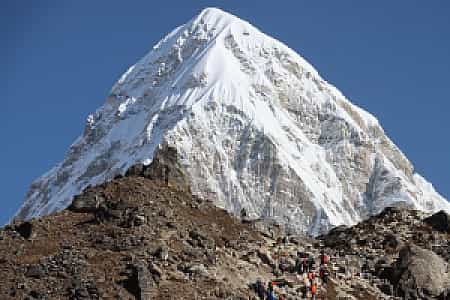 Snow-covered Pumori peak rising dramatically above the Khumbu region during the EBC trek