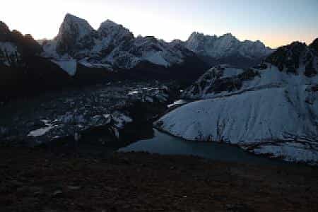 Morning view from Gokyo Ri showing Gokyo Lake, Ngozumpa Glacier, and Cholatse Peak in the distance