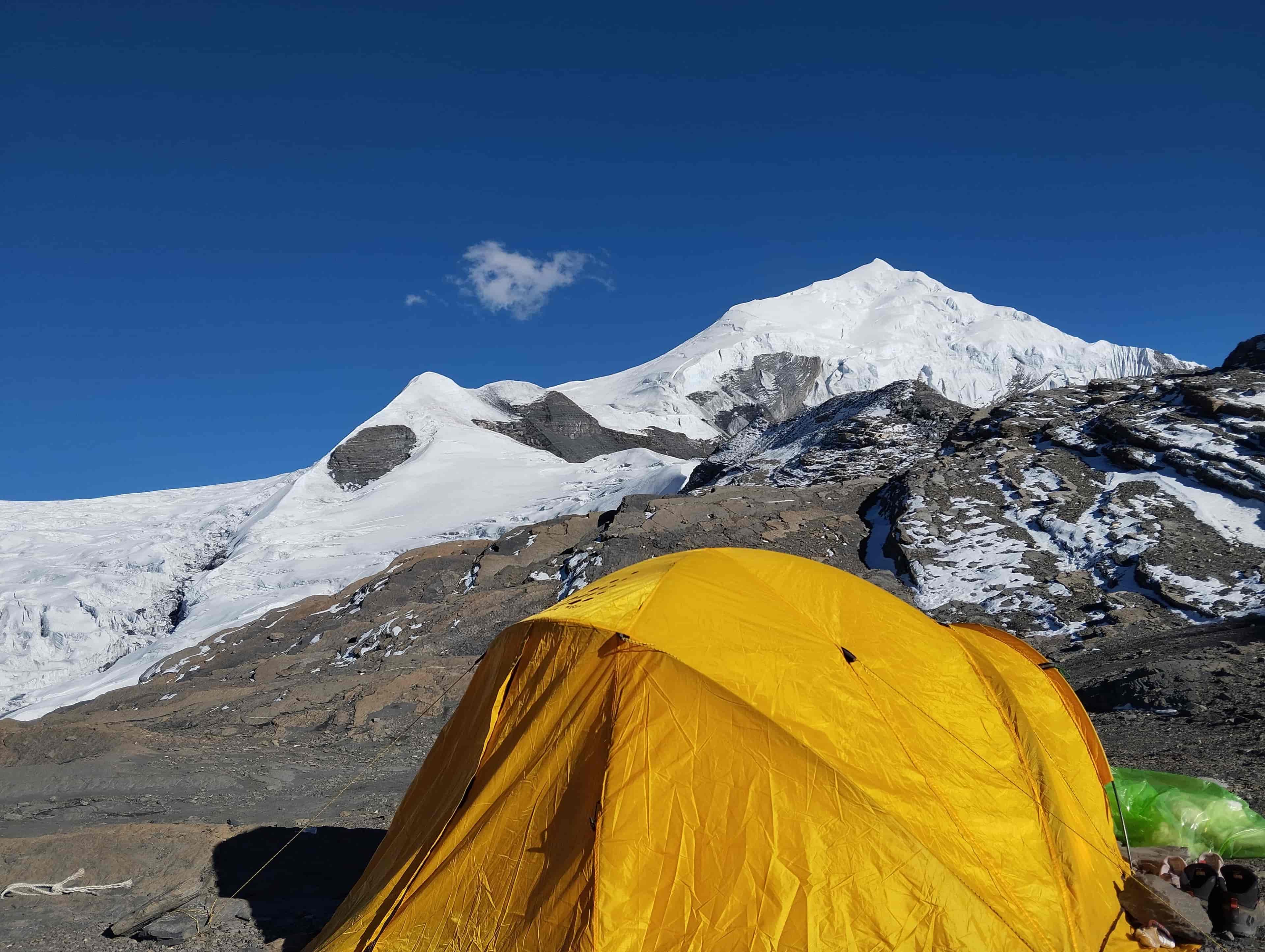 Snow-covered Chulu West Peak from Camp 1 on climbing expedition in Annapurna region